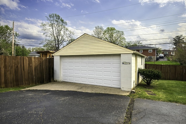 detached garage with fence