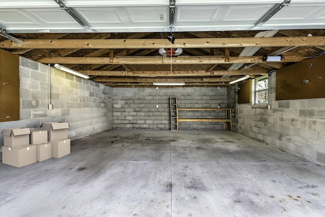 garage featuring concrete block wall