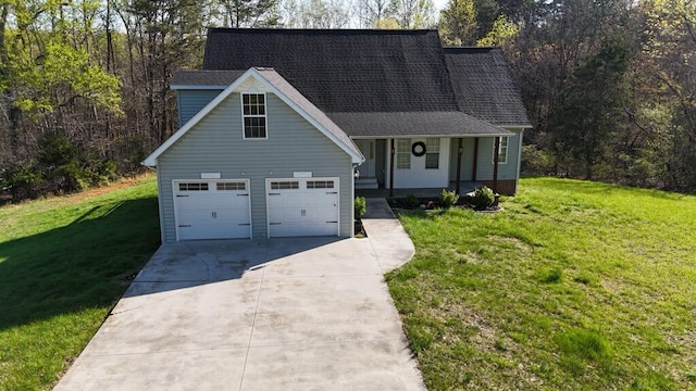 traditional home with a porch, driveway, and a front yard