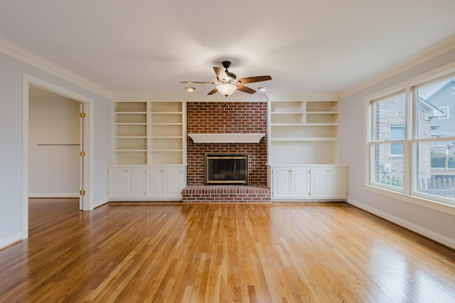 unfurnished living room featuring a ceiling fan, baseboards, built in features, and light wood-type flooring