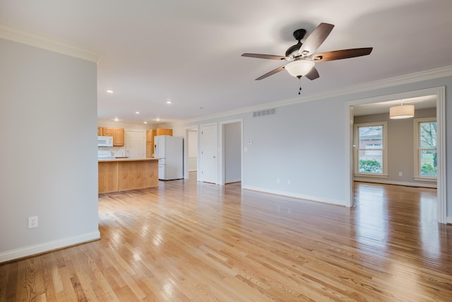 unfurnished living room with light wood-style floors, ceiling fan, visible vents, baseboards, and ornamental molding