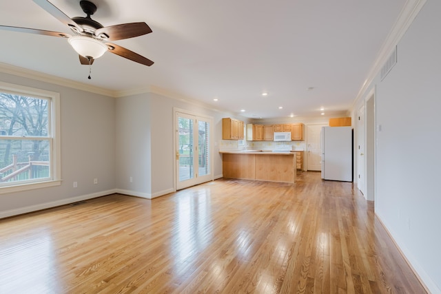 unfurnished living room with recessed lighting, crown molding, a ceiling fan, light wood-style flooring, and baseboards