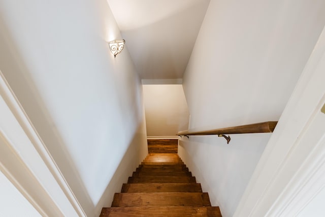 staircase featuring wood finished floors