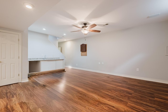 interior space with baseboards, recessed lighting, wood finished floors, and a ceiling fan