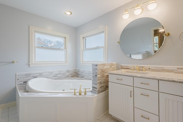 full bath featuring tile patterned floors, vanity, and a whirlpool tub