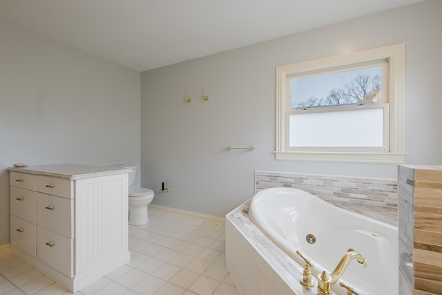 bathroom featuring a whirlpool tub, tile patterned flooring, toilet, and baseboards