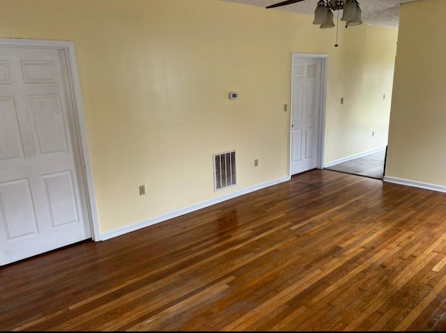 115 Georgia St, Winchester, KY 40391 - spare room featuring visible vents, baseboards, a ceiling fan, and dark wood-style floors