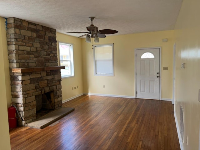 115 Georgia St, Winchester, KY 40391 - unfurnished living room with baseboards, a ceiling fan, hardwood / wood-style floors, and a textured ceiling