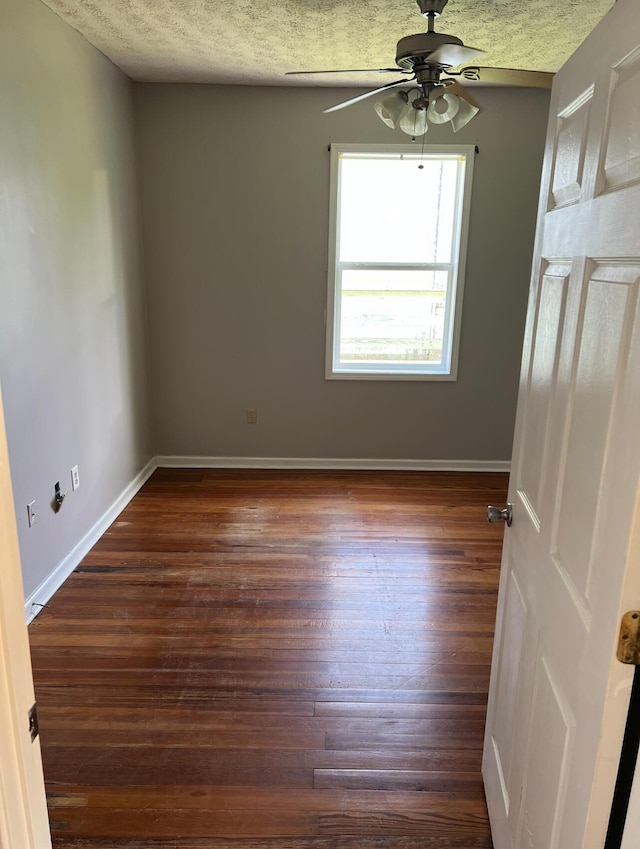 115 Georgia St, Winchester, KY 40391 - unfurnished room with dark wood-style flooring, baseboards, a ceiling fan, and a textured ceiling