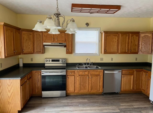 115 Georgia St, Winchester, KY 40391 - kitchen featuring a sink, brown cabinets, under cabinet range hood, and stainless steel appliances