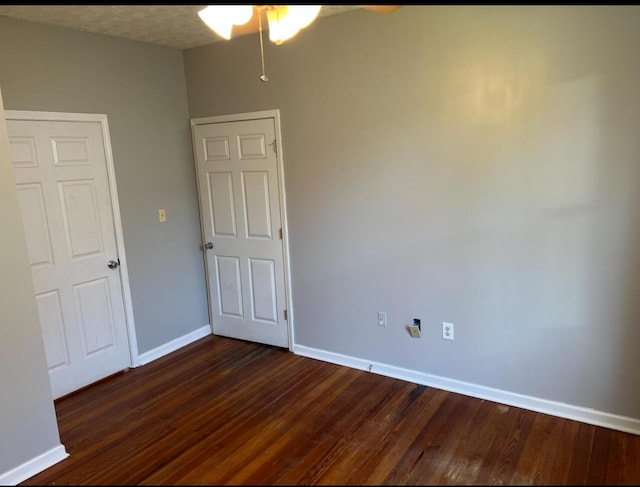 115 Georgia St, Winchester, KY 40391 - unfurnished bedroom with dark wood-style flooring and baseboards