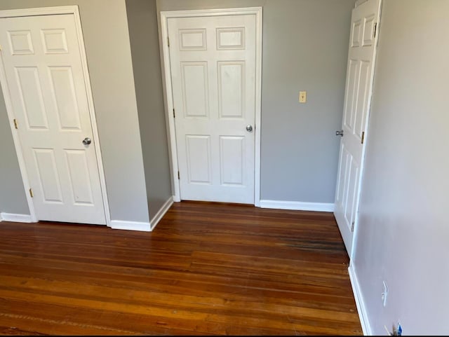 115 Georgia St, Winchester, KY 40391 - unfurnished bedroom featuring baseboards and dark wood-style floors
