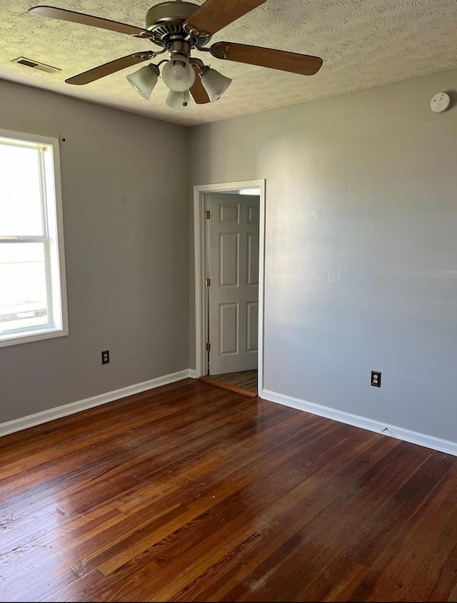 115 Georgia St, Winchester, KY 40391 - spare room with dark wood-style floors, baseboards, visible vents, and ceiling fan