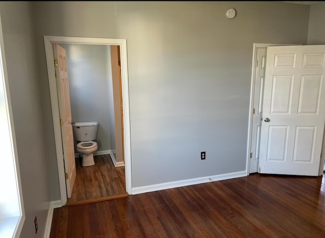 115 Georgia St, Winchester, KY 40391 - unfurnished bedroom with dark wood-style flooring and baseboards