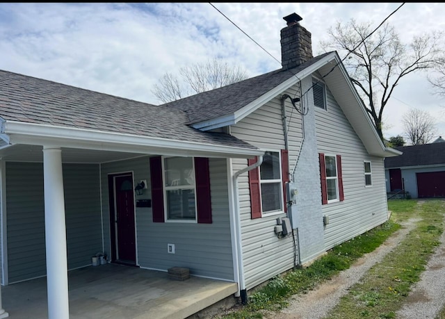 115 Georgia St, Winchester, KY 40391 - view of property exterior with a chimney and a shingled roof