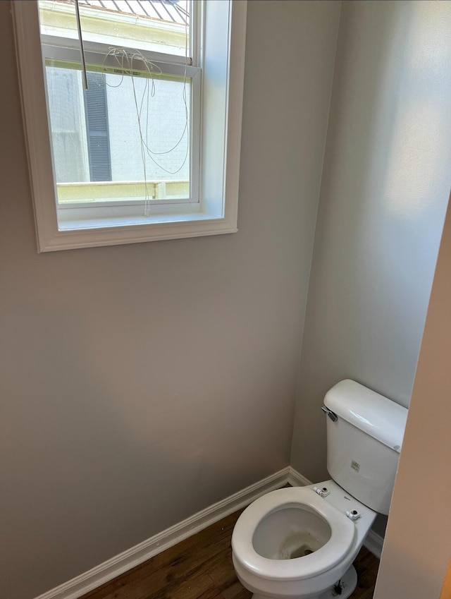 115 Georgia St, Winchester, KY 40391 - bathroom featuring toilet, baseboards, and wood finished floors