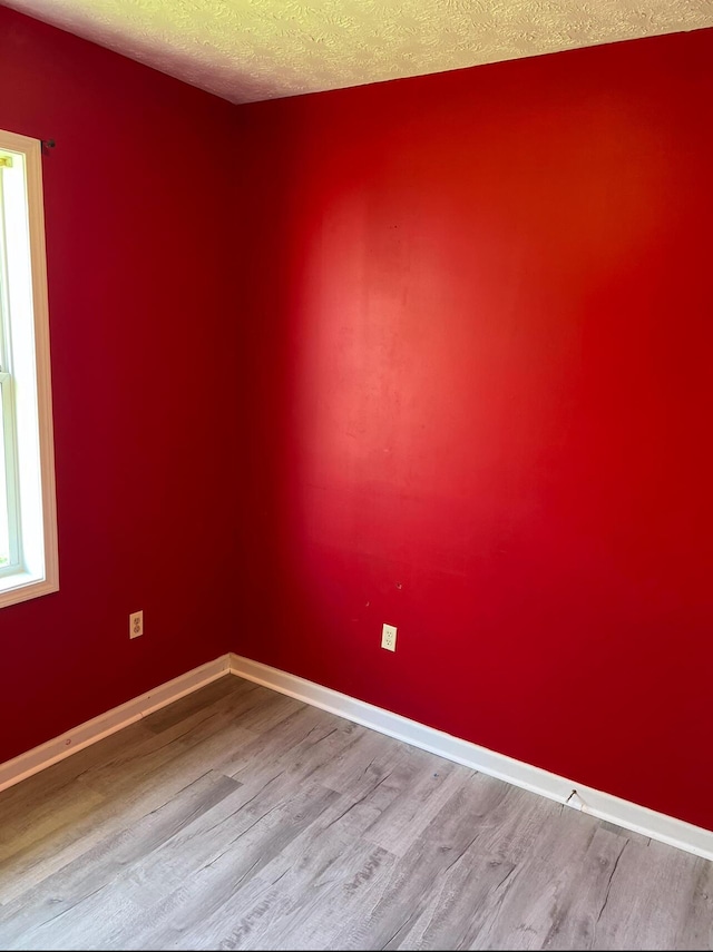 115 Georgia St, Winchester, KY 40391 - unfurnished room with baseboards, wood finished floors, and a textured ceiling