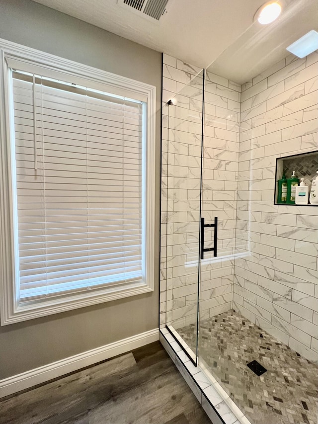 108 Allyson Cir, Junction City, KY 40440 - bathroom with a stall shower, wood finished floors, baseboards, and visible vents