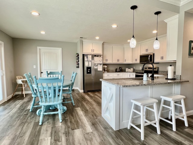 108 Allyson Cir, Junction City, KY 40440 - kitchen featuring a peninsula, dark wood finished floors, white cabinetry, and stainless steel appliances
