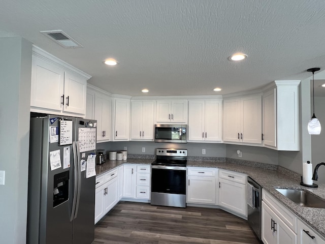 108 Allyson Cir, Junction City, KY 40440 - kitchen with visible vents, white cabinets, a sink, appliances with stainless steel finishes, and dark wood-type flooring