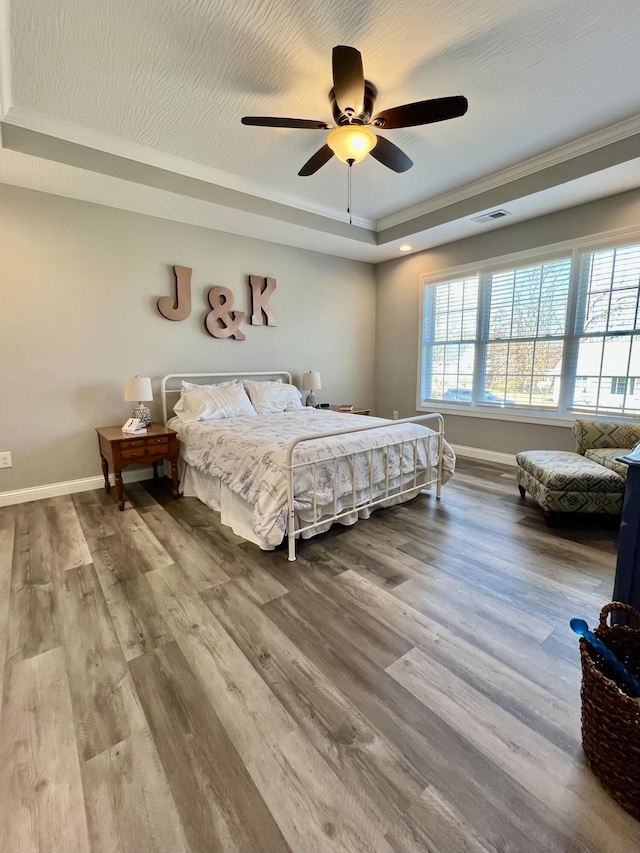 108 Allyson Cir, Junction City, KY 40440 - bedroom featuring a raised ceiling, wood finished floors, baseboards, and visible vents