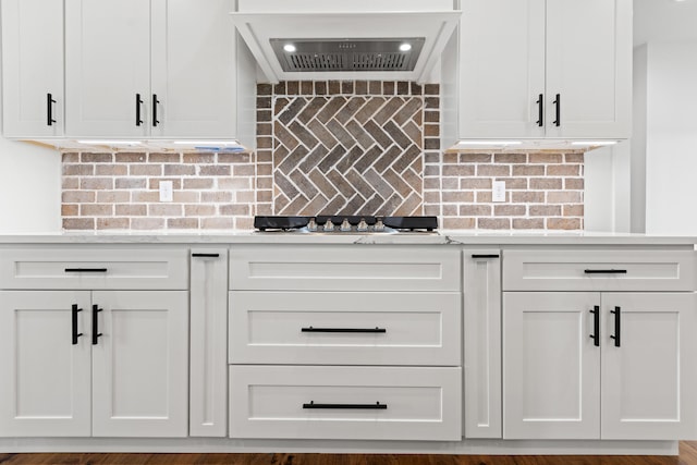 215 Berkley Hall Dr, Berea, KY 40403 - kitchen with custom exhaust hood, white cabinetry, and backsplash