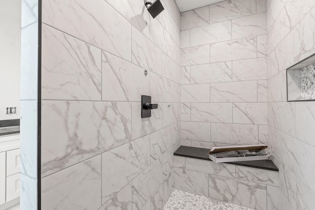 bathroom featuring tiled shower
