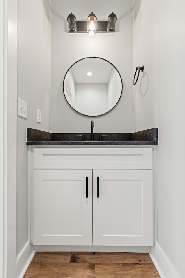 215 Berkley Hall Dr, Berea, KY 40403 - bathroom with vanity, wood finished floors, and baseboards