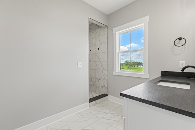 215 Berkley Hall Dr, Berea, KY 40403 - bathroom featuring marble look tile flooring, baseboards, a tile shower, and vanity