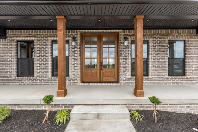 215 Berkley Hall Dr, Berea, KY 40403 - view of exterior entry featuring a porch, brick siding, and french doors