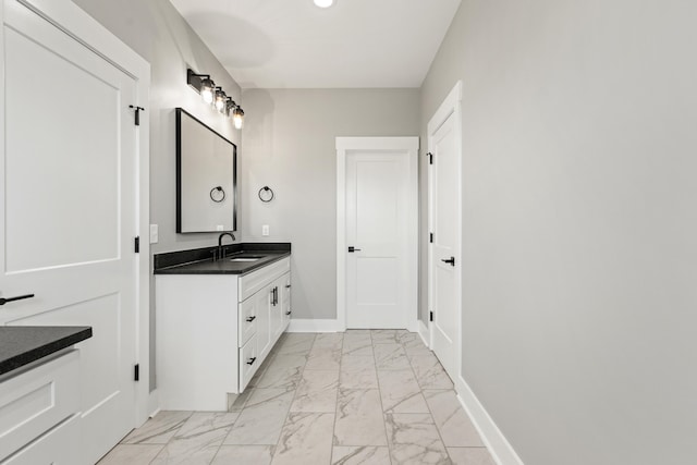 215 Berkley Hall Dr, Berea, KY 40403 - bathroom featuring marble look tiles, vanity, and baseboards
