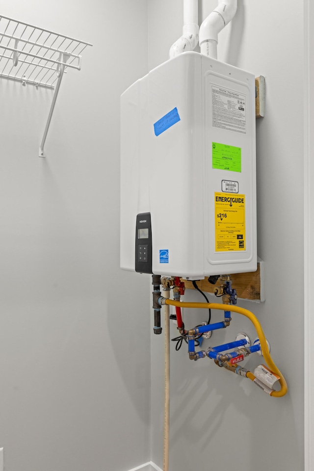 215 Berkley Hall Dr, Berea, KY 40403 - utility room with tankless water heater