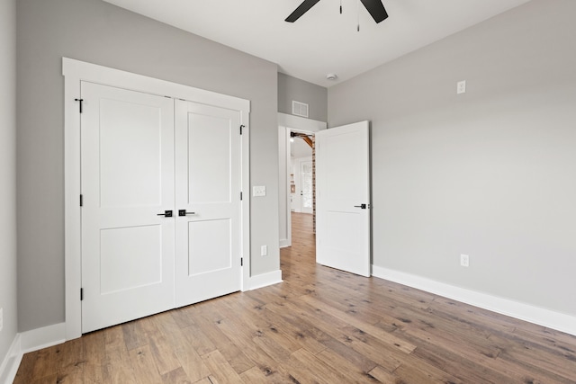 215 Berkley Hall Dr, Berea, KY 40403 - unfurnished bedroom with wood finished floors, baseboards, a closet, and ceiling fan