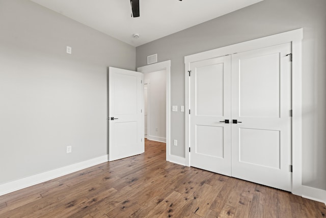 215 Berkley Hall Dr, Berea, KY 40403 - unfurnished bedroom featuring wood finished floors, baseboards, a closet, and ceiling fan