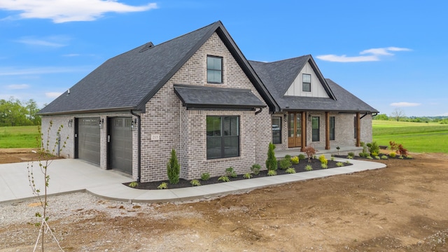 215 Berkley Hall Dr, Berea, KY 40403 - view of front of home with brick siding, concrete driveway, roof with shingles, and an attached garage