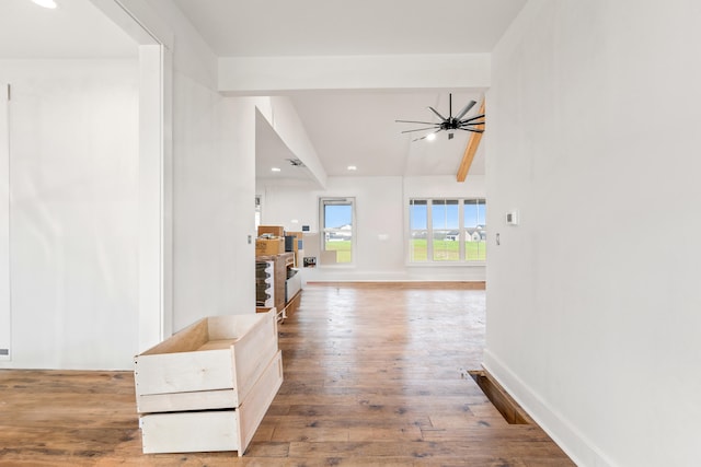 hall with wood finished floors, baseboards, vaulted ceiling with beams, and recessed lighting