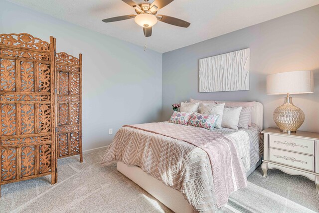 bedroom featuring baseboards, a ceiling fan, and carpet floors