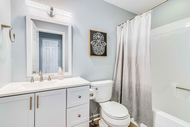 full bathroom with shower / bath combo, vanity, and toilet
