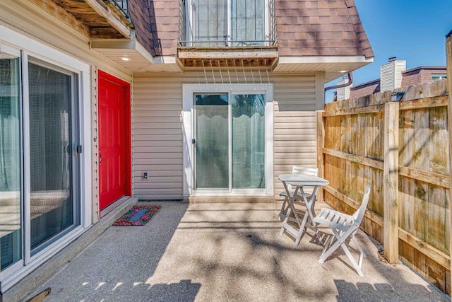 view of patio featuring fence