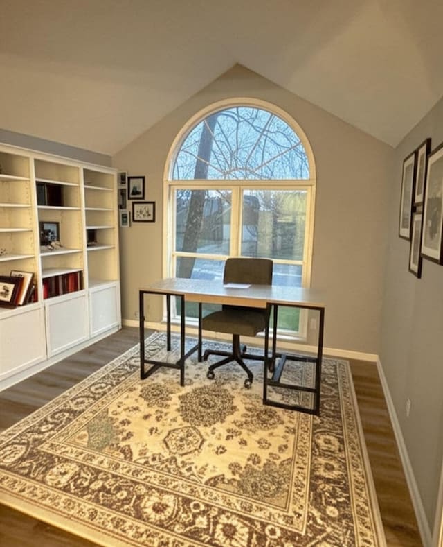 home office with vaulted ceiling, baseboards, and dark wood finished floors