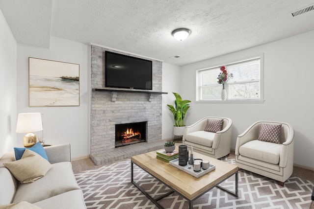 carpeted living room with a textured ceiling, visible vents, baseboards, and a fireplace