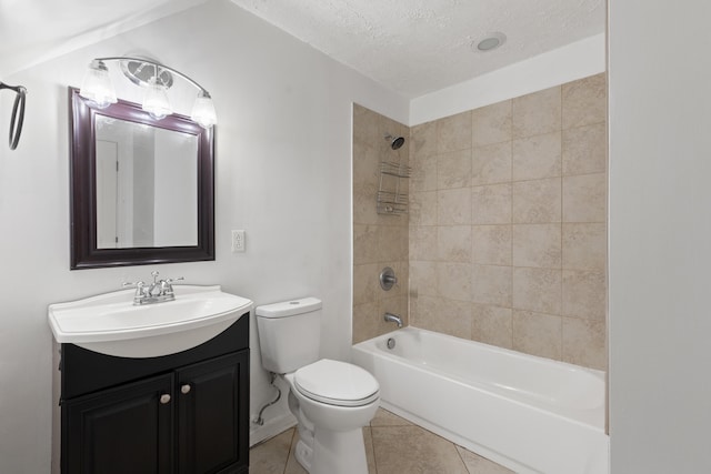bathroom featuring tile patterned flooring, bathtub / shower combination, toilet, vanity, and a textured ceiling
