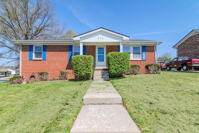 406 Kenway St, Berea, KY 40403 - view of front facade featuring brick siding and a front yard