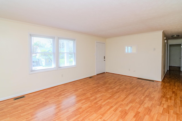406 Kenway St, Berea, KY 40403 - spare room with light wood-style floors, visible vents, baseboards, and ornamental molding
