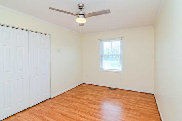 406 Kenway St, Berea, KY 40403 - unfurnished bedroom with visible vents, light wood-style floors, and crown molding