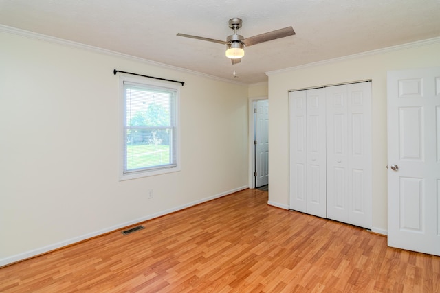 406 Kenway St, Berea, KY 40403 - unfurnished bedroom with crown molding, a closet, light wood finished floors, baseboards, and visible vents