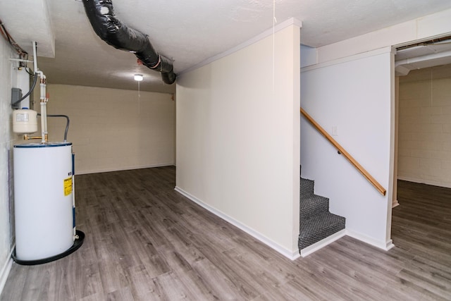 406 Kenway St, Berea, KY 40403 - finished basement with water heater, concrete block wall, wood finished floors, and stairs