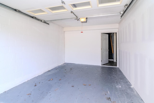 406 Kenway St, Berea, KY 40403 - garage with concrete block wall and a garage door opener