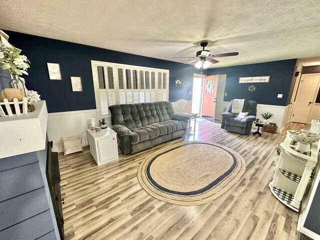 1870 Rush Branch Rd, Somerset, KY 42501 - living room featuring light wood-style flooring, a ceiling fan, and a textured ceiling
