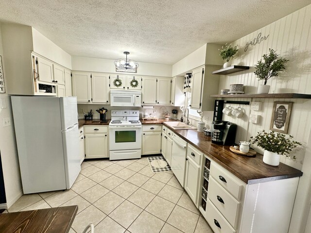 1870 Rush Branch Rd, Somerset, KY 42501 - kitchen with light tile patterned floors, open shelves, a sink, white appliances, and a chandelier